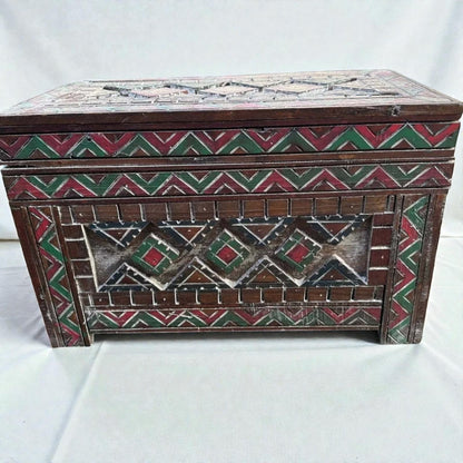 AtlasMuseCrafts handmade wooden storage cabinet with carved Berber patterns in red, green, and white. Rustic boho style.