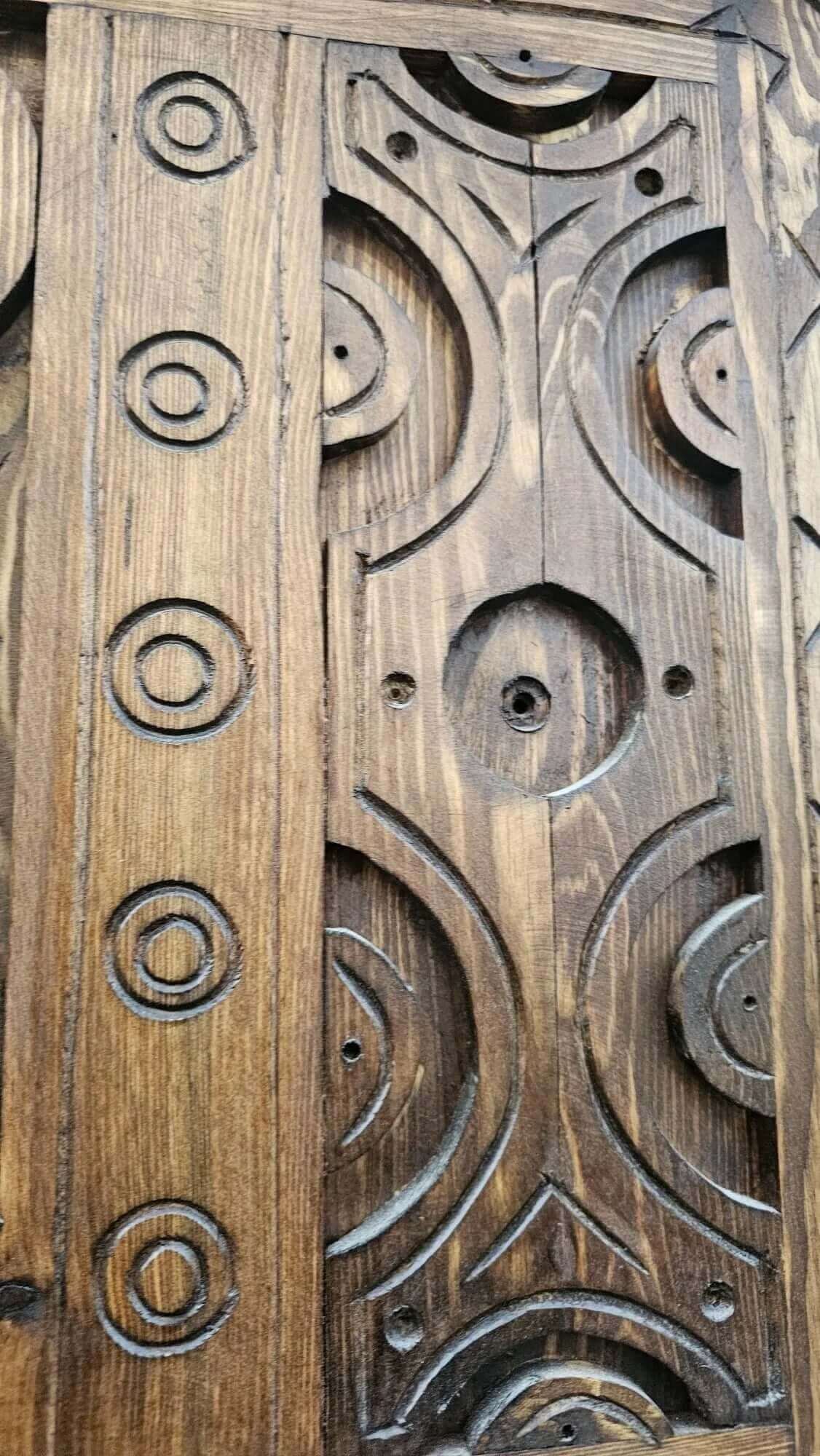 AtlasMuseCrafts antique Moroccan door, natural wood with intricate Berber carving. Traditional tribal motifs.