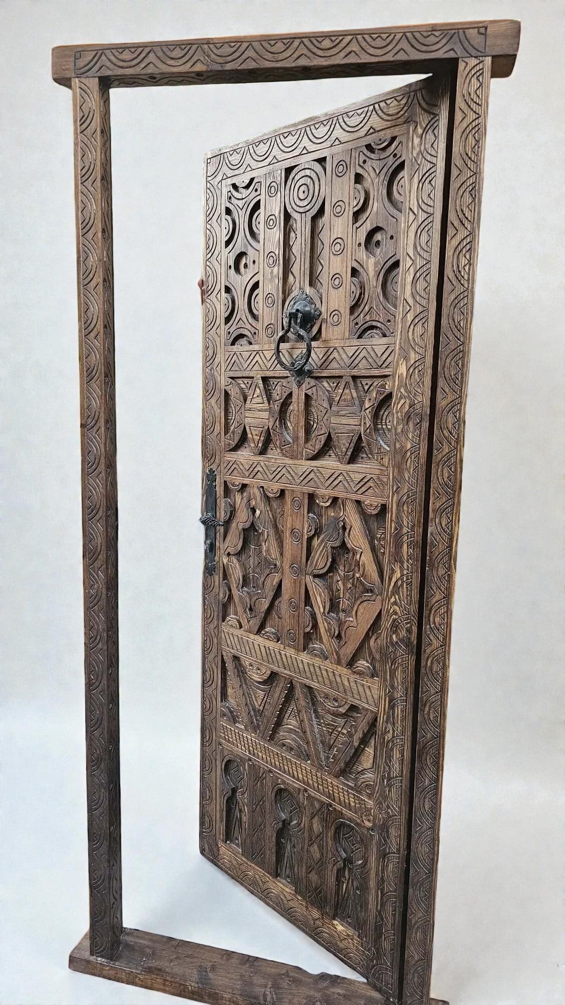 AtlasMuseCrafts antique Moroccan door, natural wood with intricate Berber carving and lion head knocker.