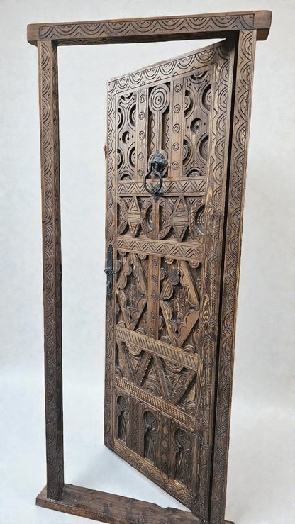 AtlasMuseCrafts antique Moroccan door, natural wood with intricate Berber carving and lion head knocker.