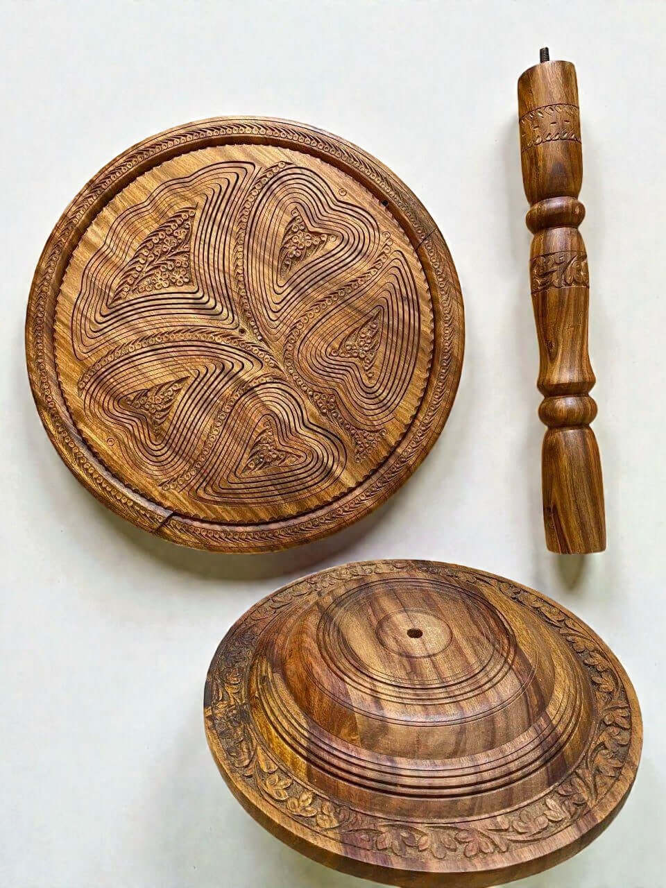 Carved wood folding fruit basket with floral border and pedestal