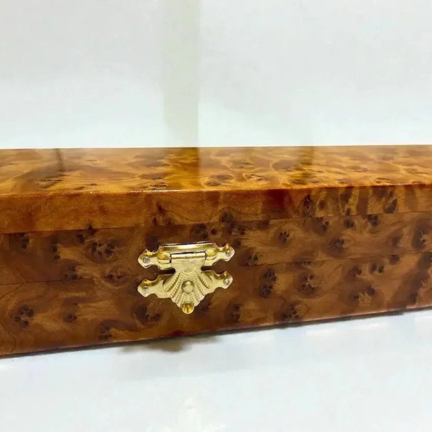 AtlasMuseCrafts elegant Thuya burl wood box with brass latch, ideal for display or storage.