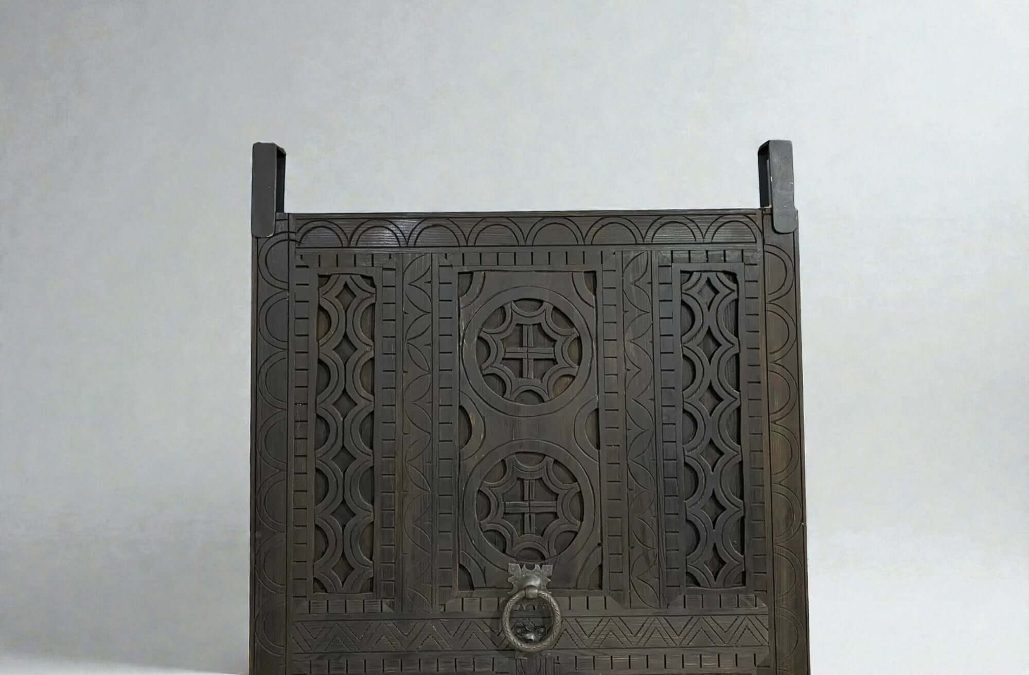 AtlasMuseCrafts dark wood door with intricate traditional floral carvings and a metal ring pull. Suitable for indoor or outdoor use.