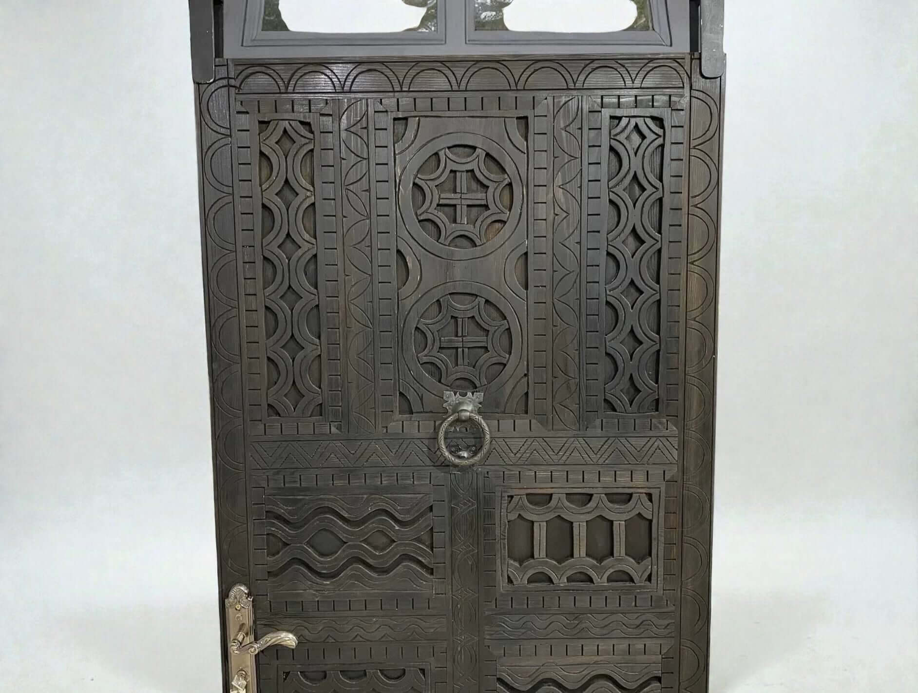 AtlasMuseCrafts dark wood door with intricate traditional floral carvings and a circular door knocker.