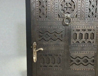 AtlasMuseCrafts dark wood door with intricate traditional floral carvings and metal hardware.