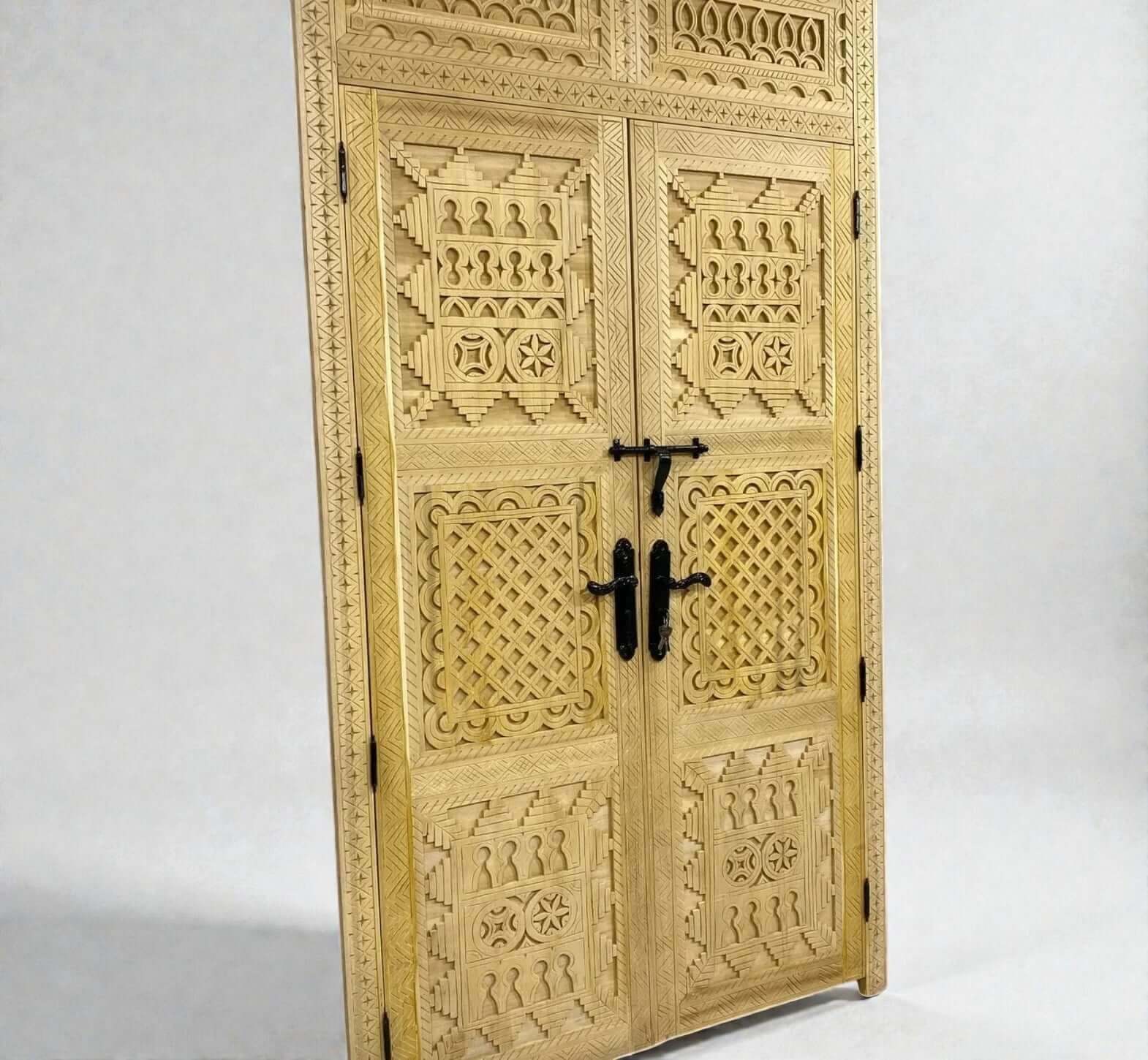 AtlasMuseCrafts handcrafted natural wood double door with intricate Berber geometric carvings and black hardware.