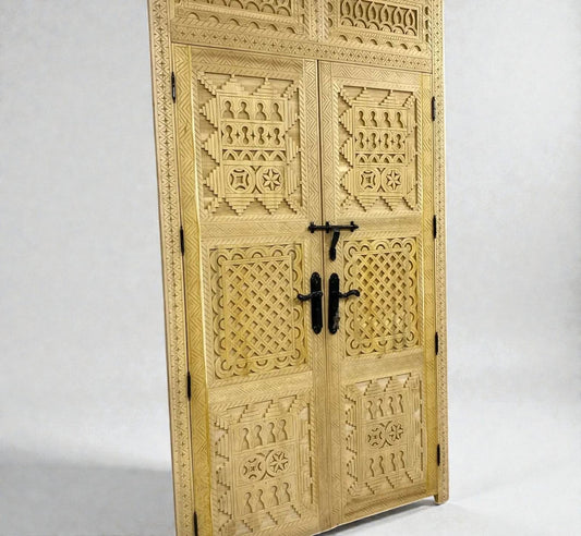 AtlasMuseCrafts handcrafted natural wood double door with intricate Berber geometric carvings and black hardware.