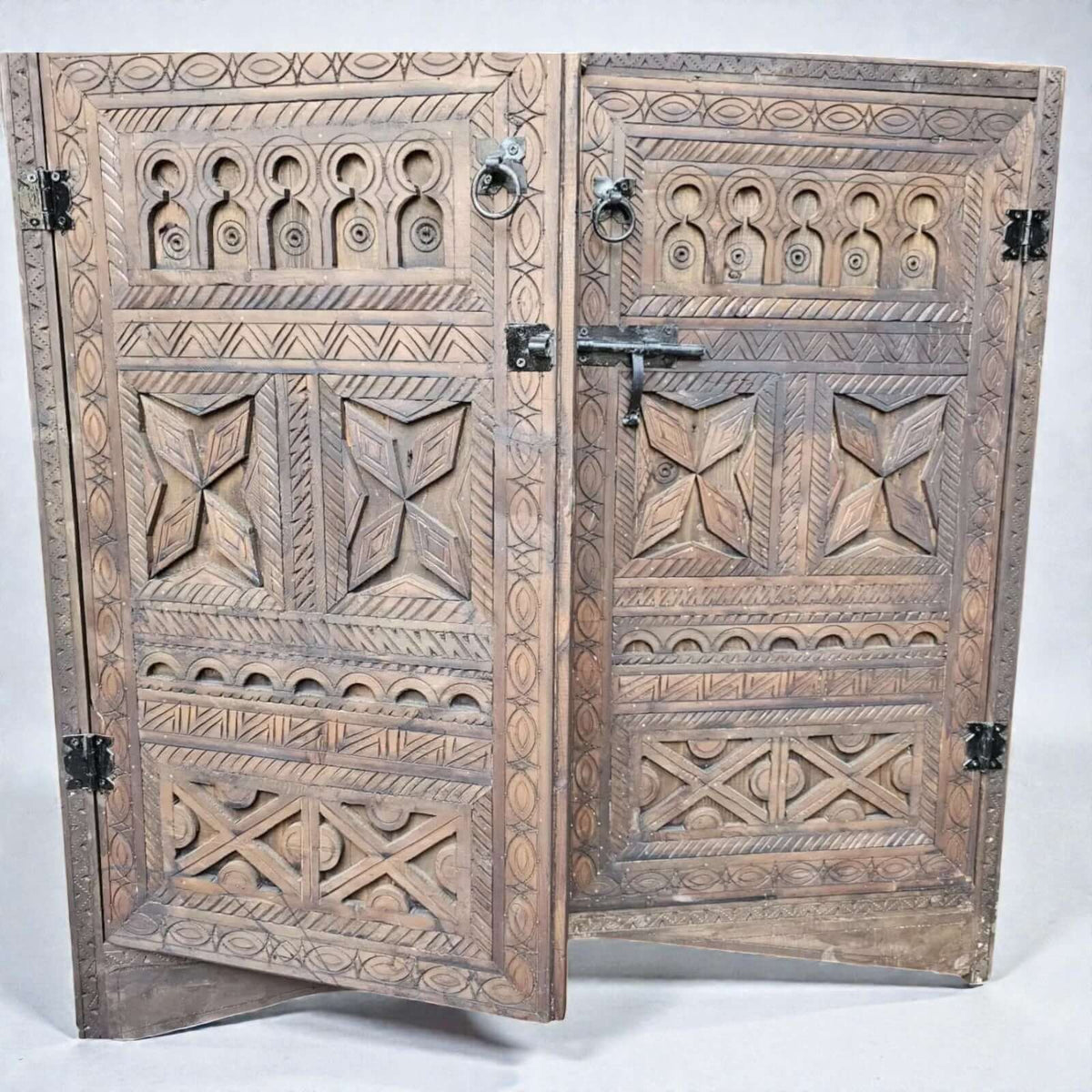 Wood storage cabinet with Moroccan Berber carving and double doors
