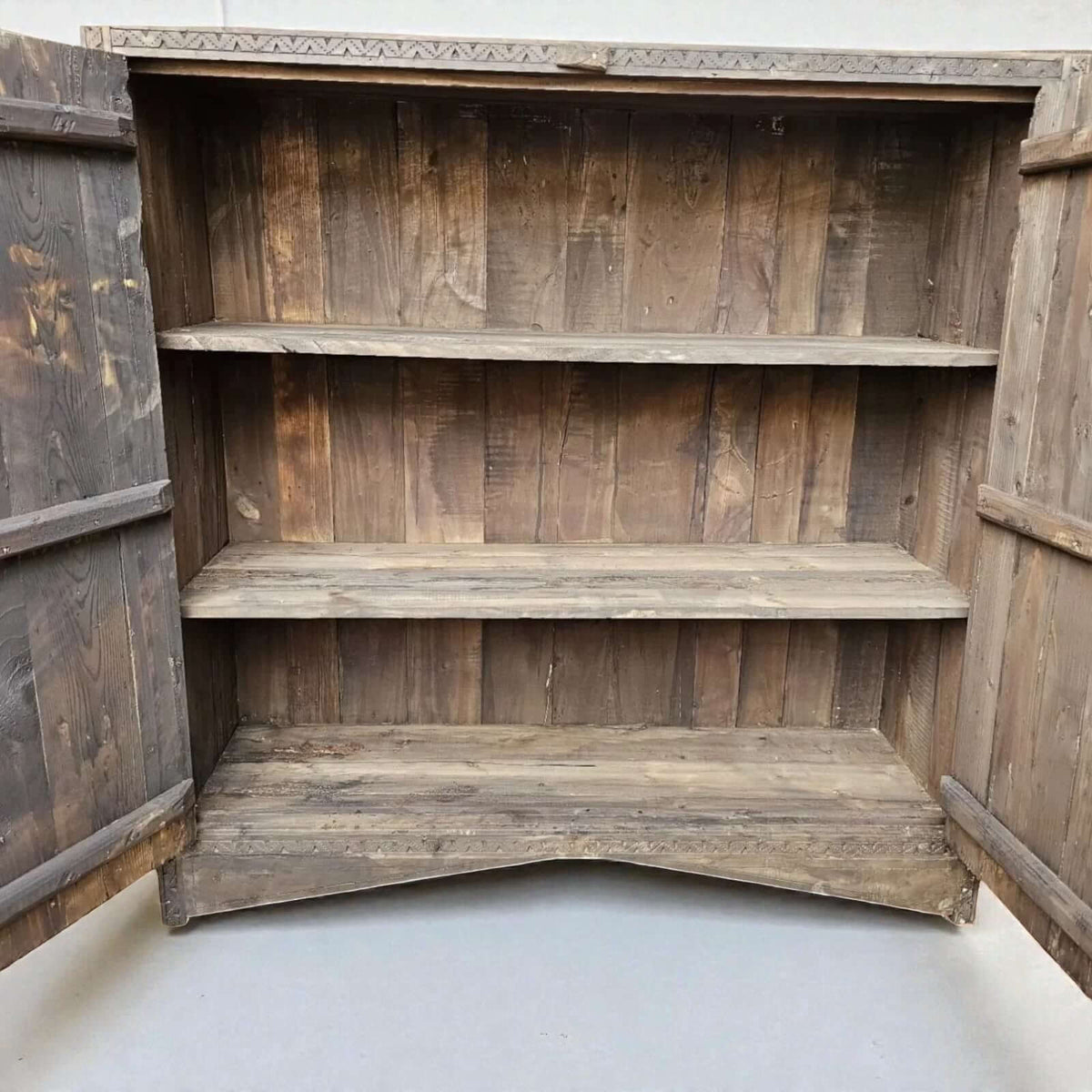 AtlasMuseCrafts handcrafted wooden cabinet with three shelves and open doors, featuring rustic boho style and Berber carvings.