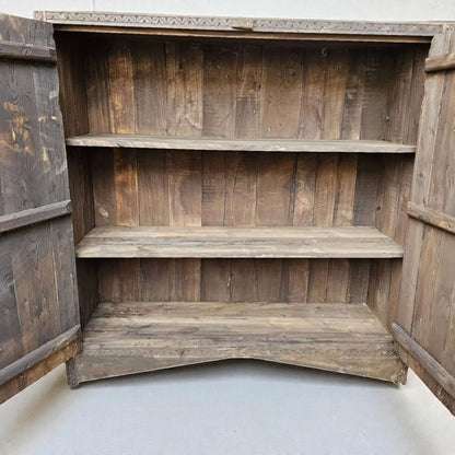 AtlasMuseCrafts handcrafted wooden cabinet with three shelves and open doors, featuring rustic boho style and Berber carvings.