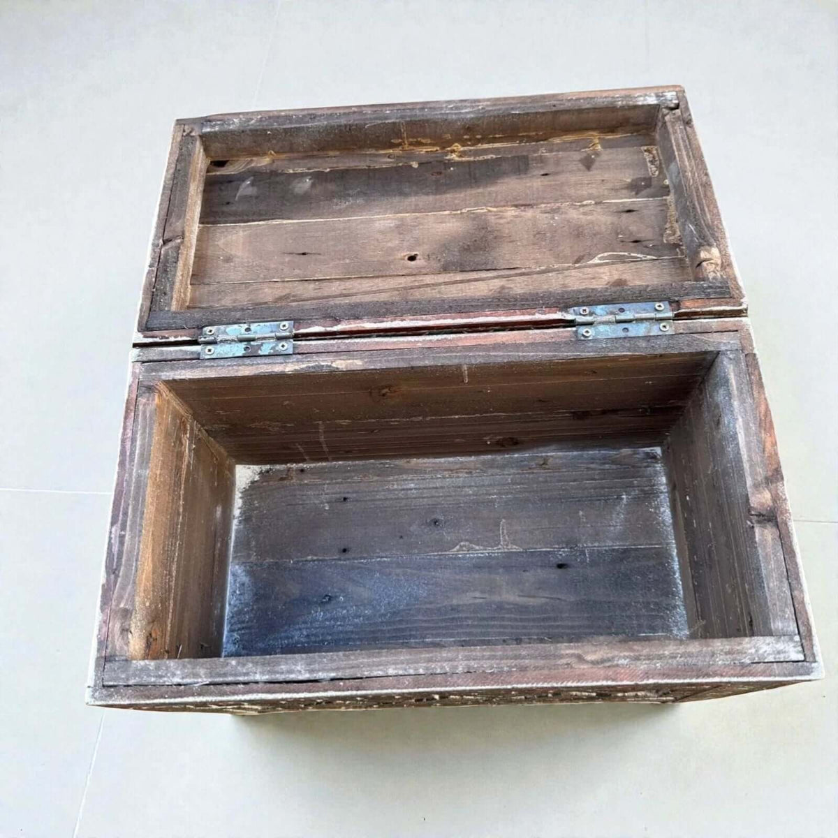 AtlasMuseCrafts handmade rustic wood storage cabinet with hinged lid and carved Berber patterns.