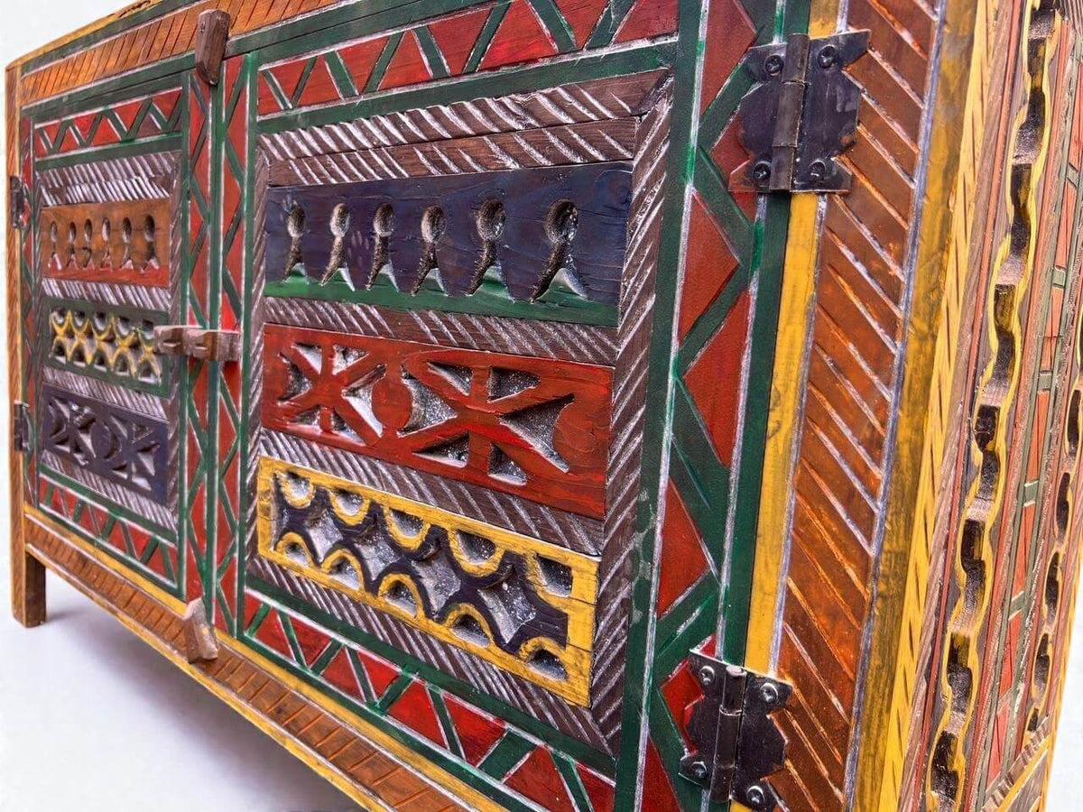 AtlasMuseCrafts handmade wooden cabinet with colorful Berber carvings and rustic boho style. Features intricate patterns, metal hinges, and a natural wood finish.