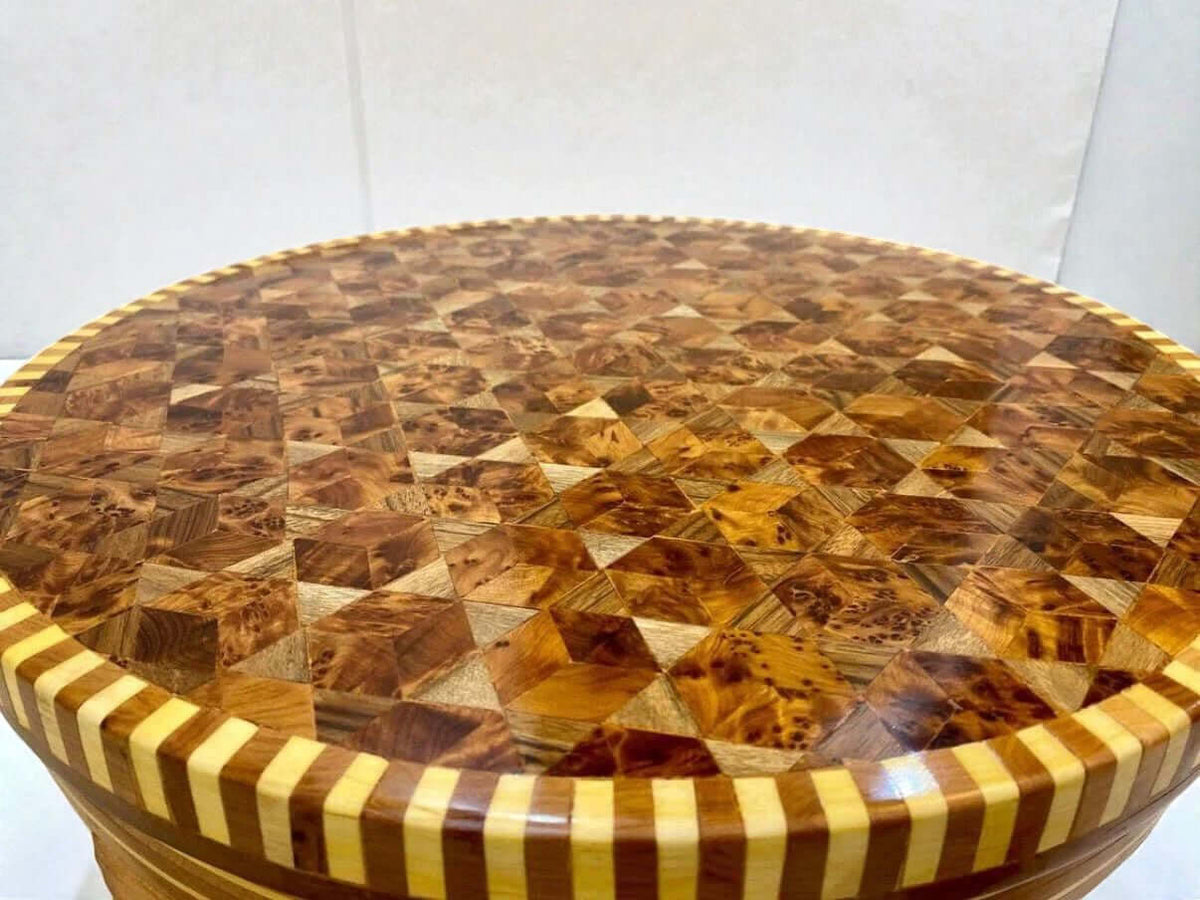 Handmade coffee table with geometric wood inlay pattern