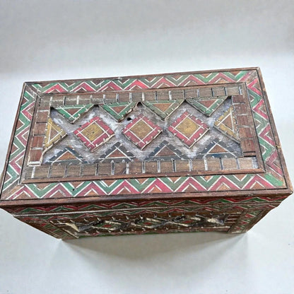 AtlasMuseCrafts handmade wooden storage cabinet with carved Berber patterns in red, green, and yellow. Rustic boho style.