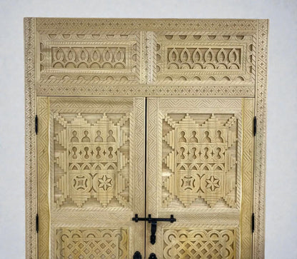 AtlasMuseCrafts handcrafted Moroccan carved wood double door with intricate Berber geometric patterns and black hardware.