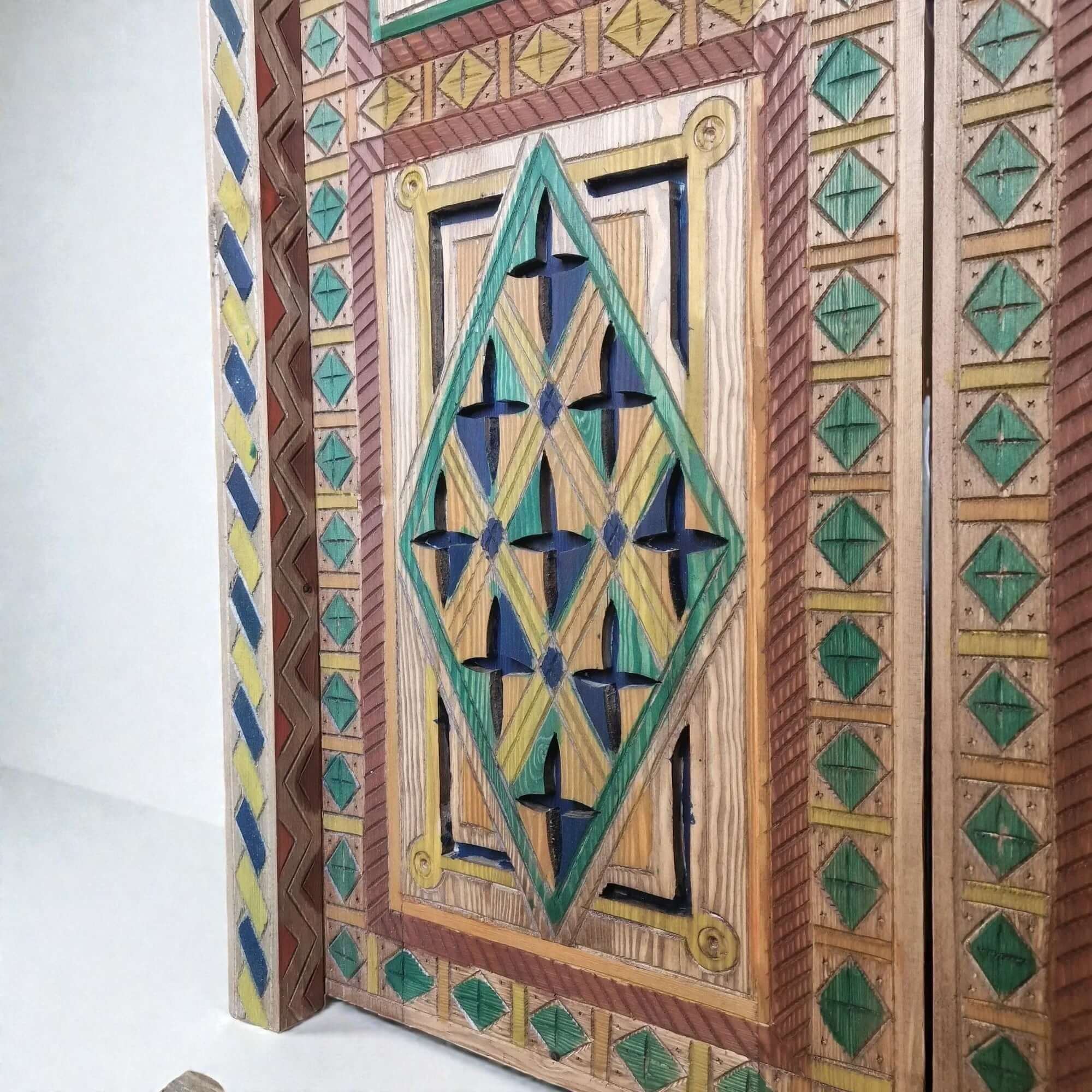 AtlasMuseCrafts hand-painted multicolor Moroccan door with geometric carving in wood. Features blue, green, yellow, and red pigments.