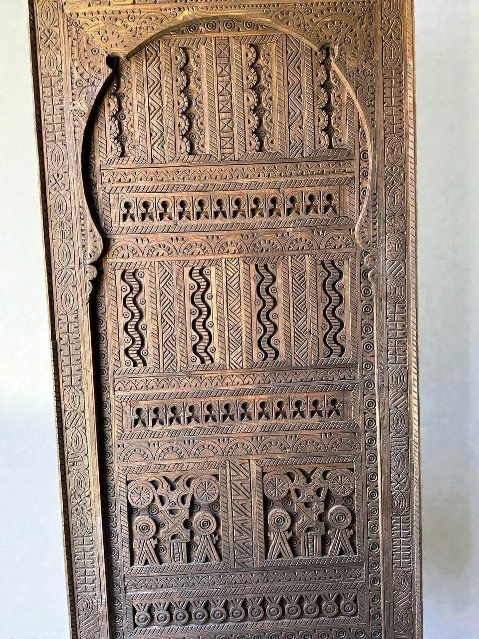 AtlasMuseCrafts custom Moroccan handmade wood door with intricate geometric carvings. Natural wood finish.