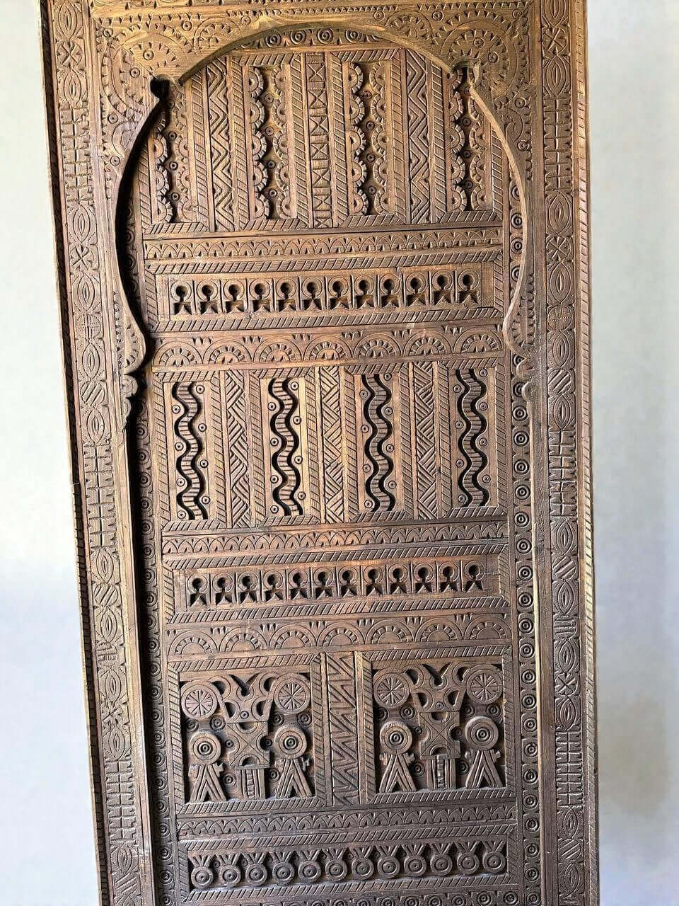 AtlasMuseCrafts custom Moroccan handmade wood door with intricate geometric carvings. Natural wood finish.