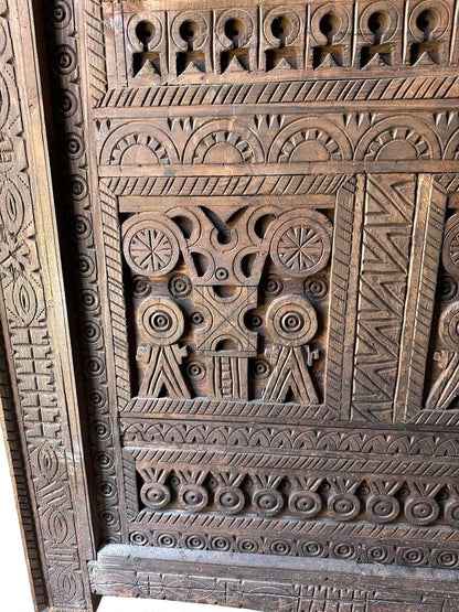AtlasMuseCrafts custom Moroccan handmade wood door with intricate geometric carvings. Natural wood finish.