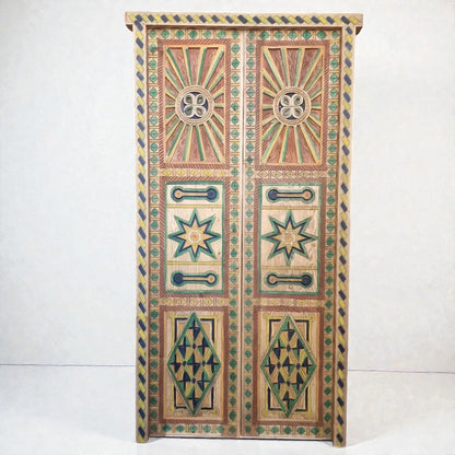 AtlasMuseCrafts hand-painted multicolor Moroccan wood door with geometric carving and sunburst motifs.