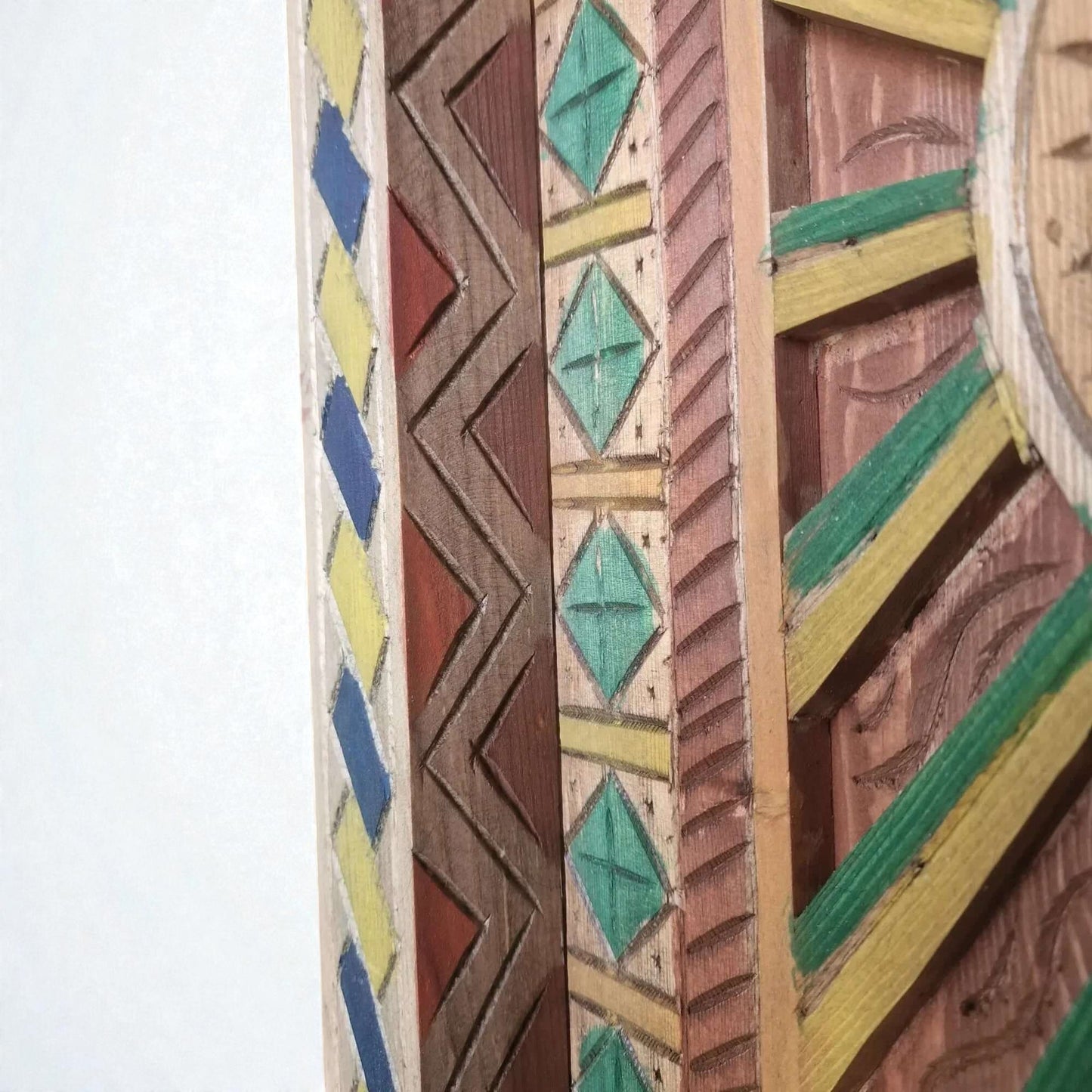 AtlasMuseCrafts hand-painted multicolor Moroccan wood door with geometric carving in blue, yellow, red, and green.