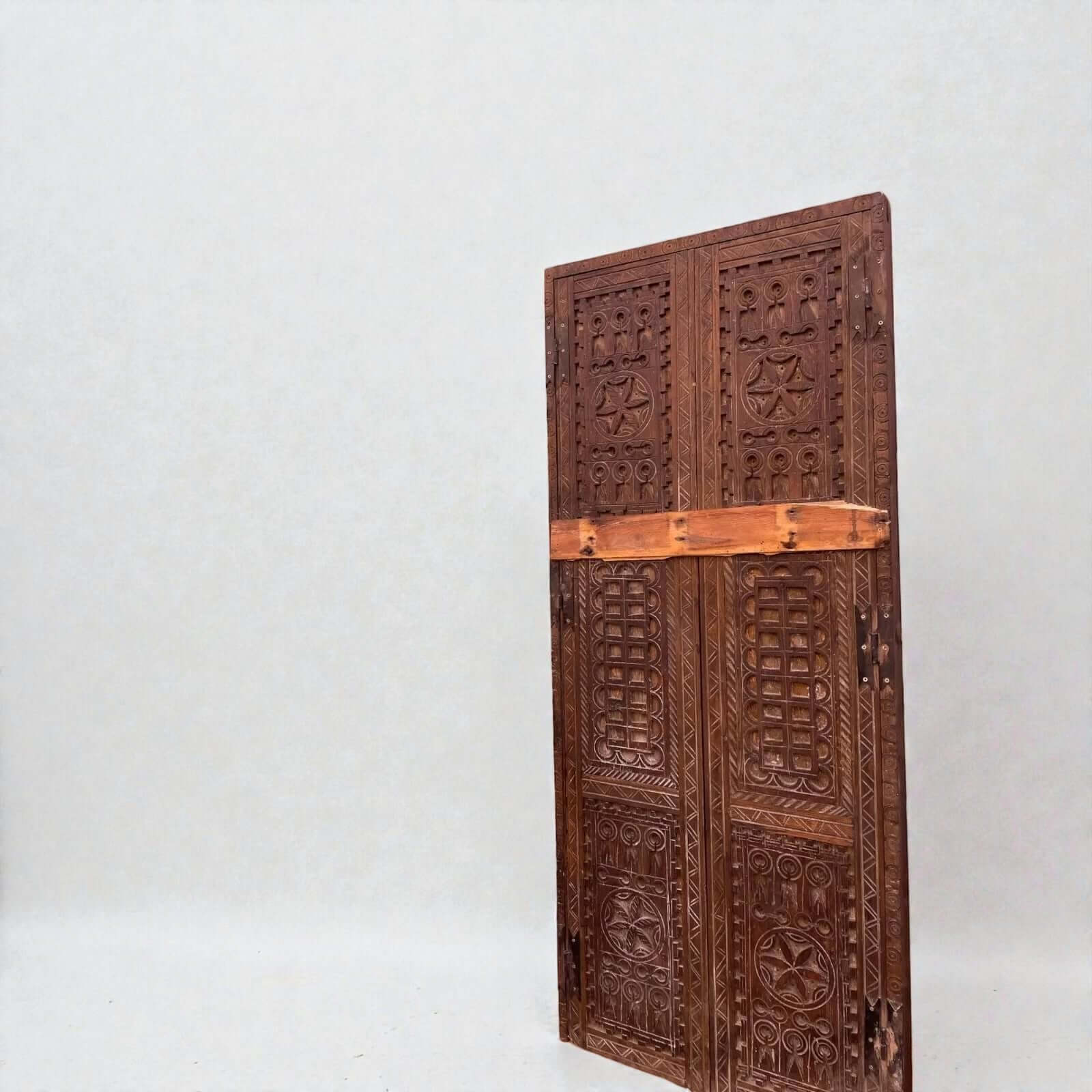 AtlasMuseCrafts natural wood double panel door with intricate hand-carved geometric motifs. Ideal for grand entryways.
