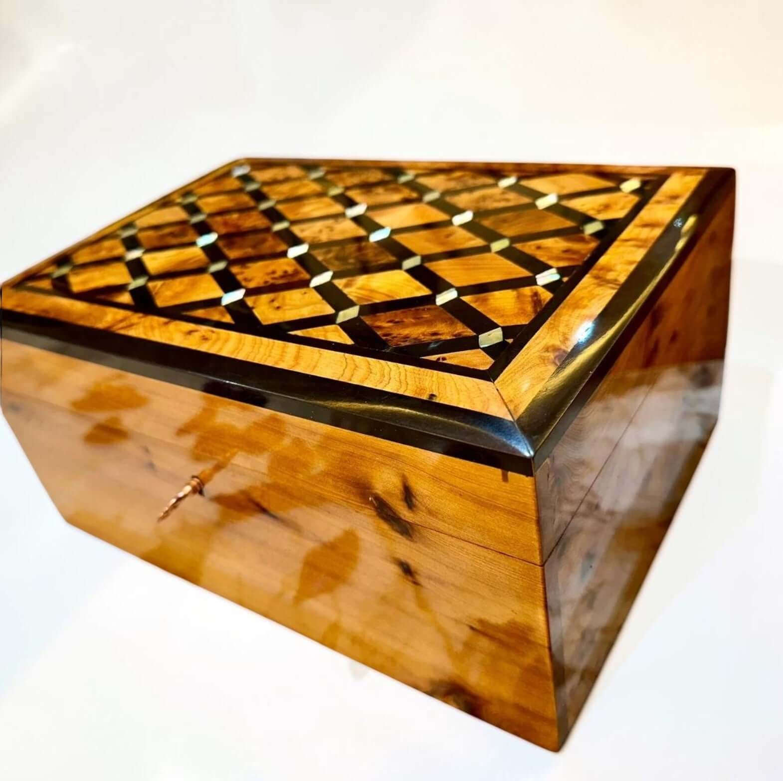 Luxury Wooden Jewelry Box made from Thuya burl wood with intricate geometric inlay design and lockable keepsake feature.