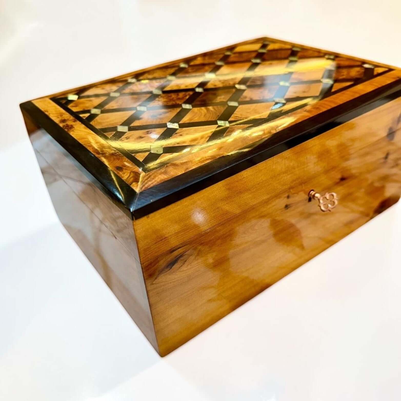 Luxury Wooden Jewelry Box crafted from Thuya burl wood with intricate geometric inlay and a polished finish.