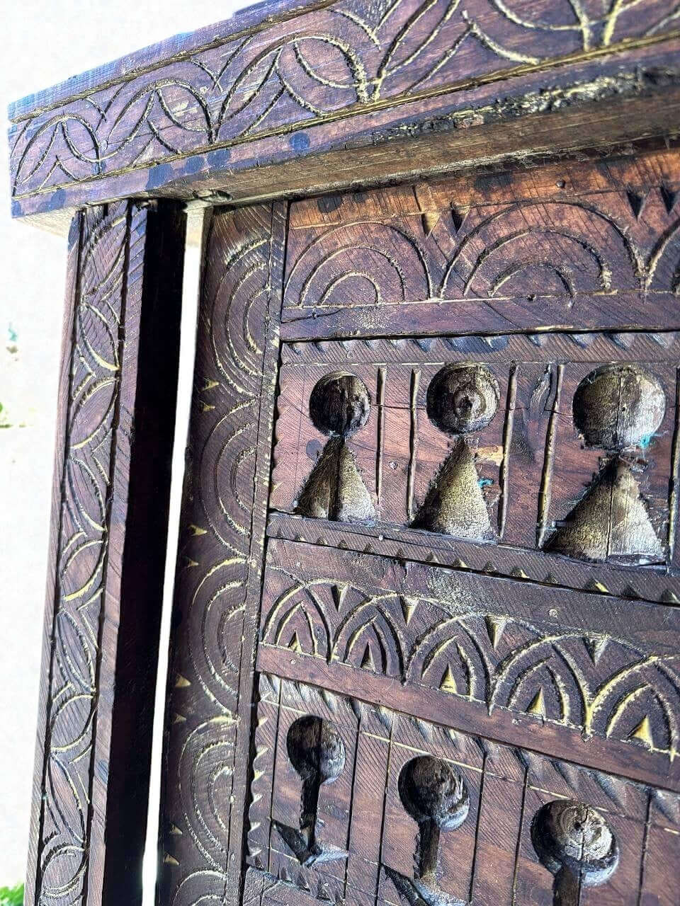 AtlasMuseCrafts vintage wooden door with floral carving and antique brass knob. Natural wood with detailed patterns.