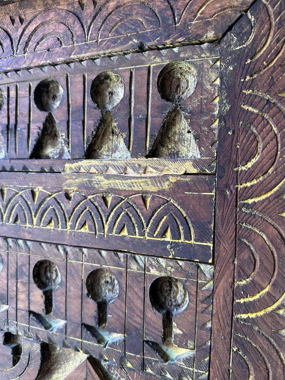 AtlasMuseCrafts vintage wooden door with intricate floral carvings and an antique brass knob. Natural wood finish.