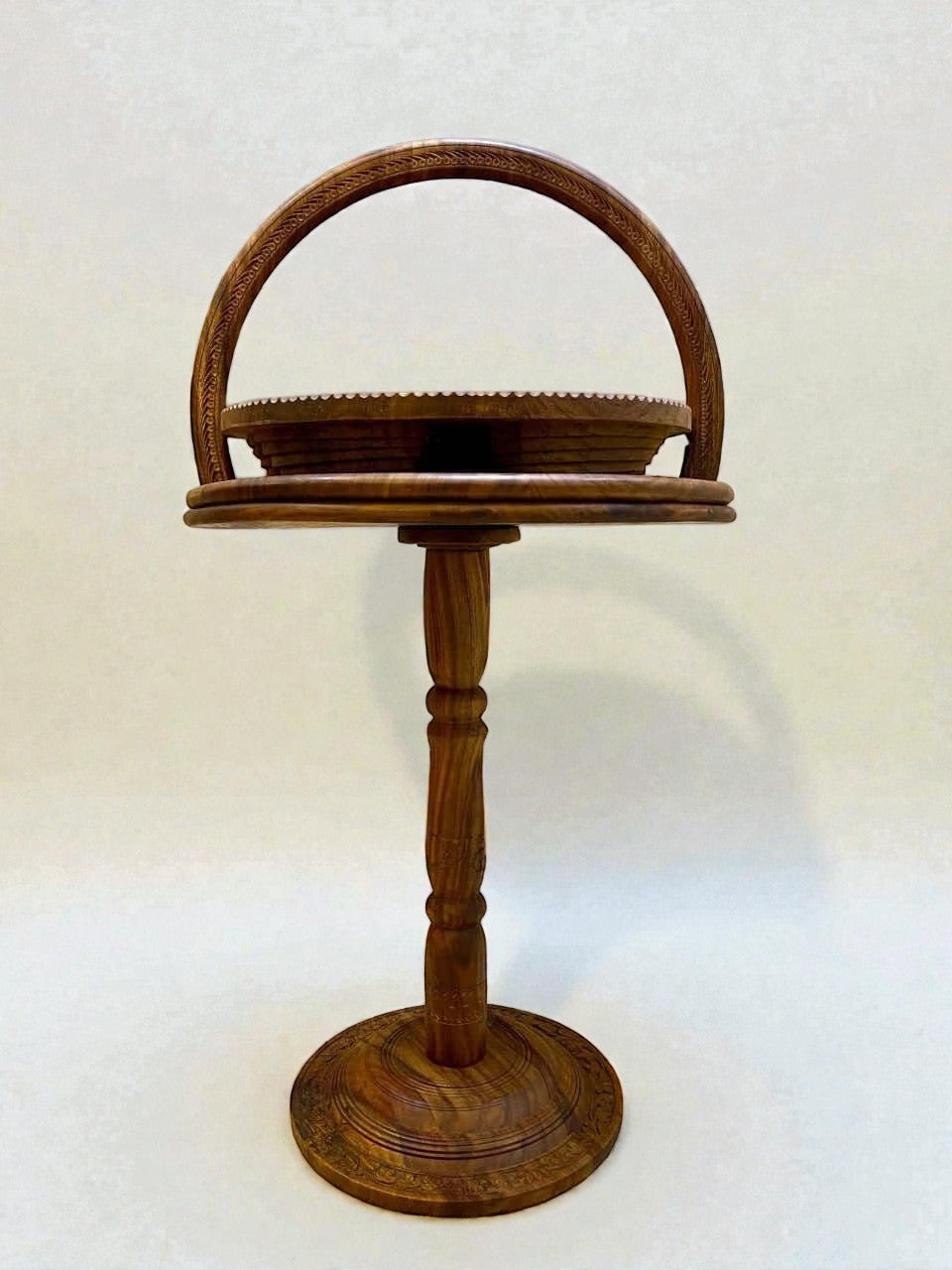 AtlasMuseCrafts handmade solid walnut tiered display stand with carved details and a curved handle.