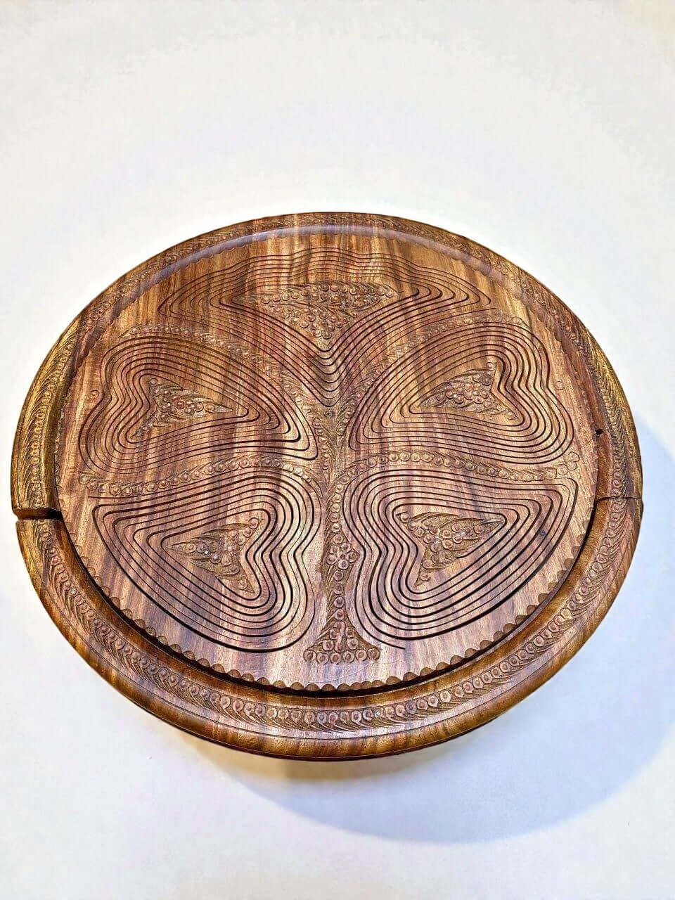 Handmade walnut folding fruit basket with carved tree design