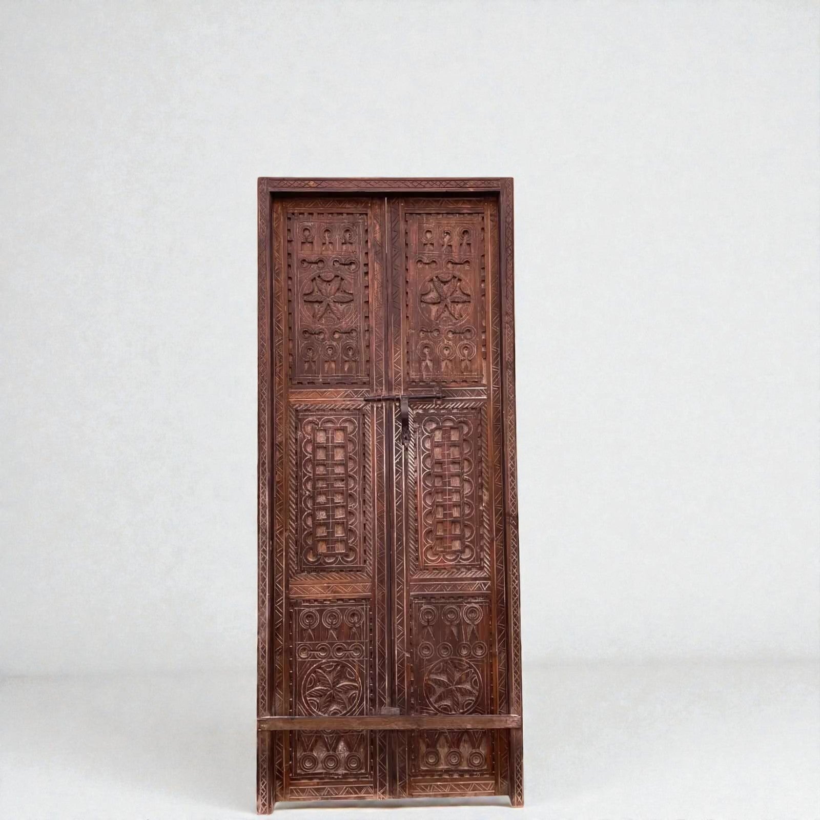 AtlasMuseCrafts double panel wooden door with intricate hand-carved geometric motifs in natural wood.