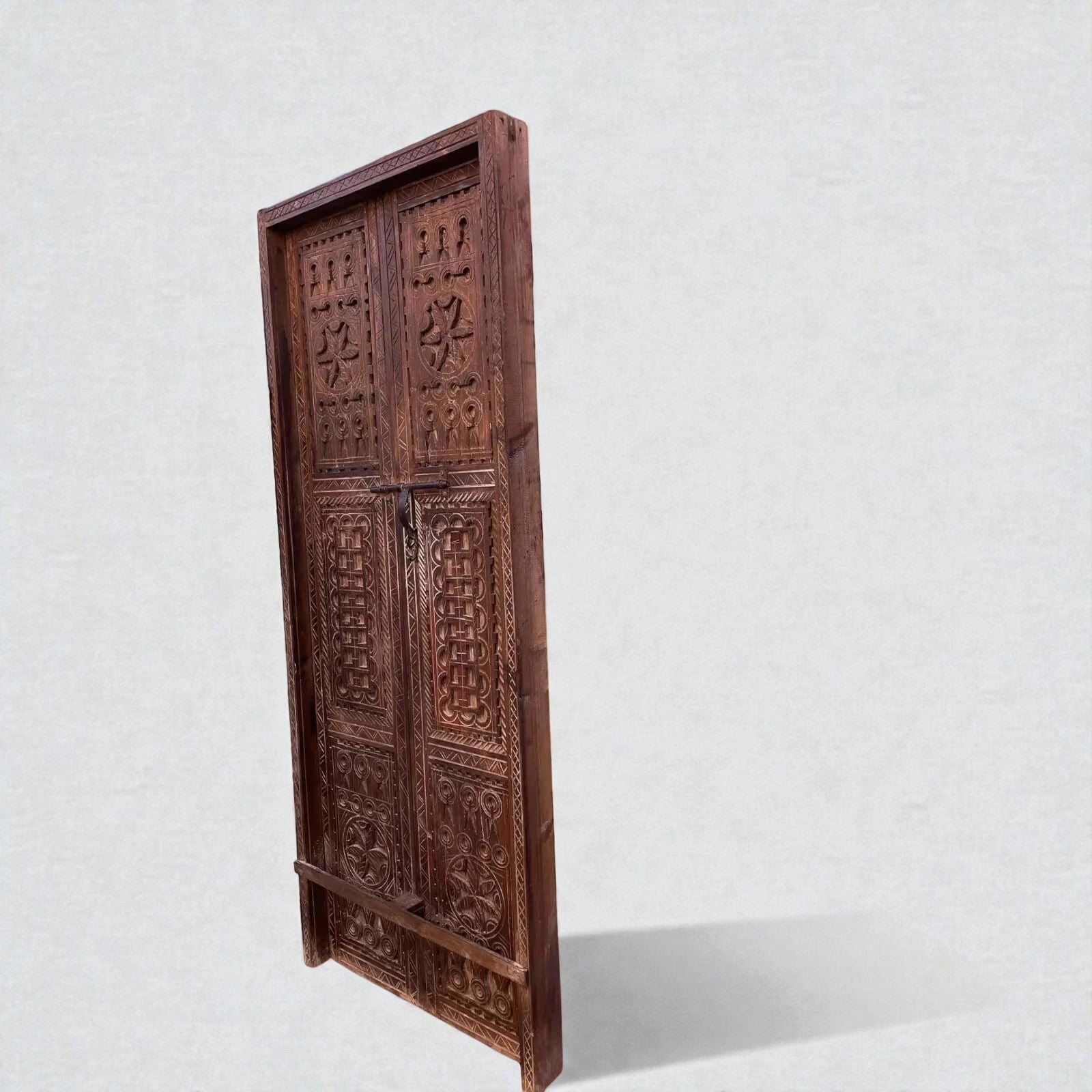 AtlasMuseCrafts natural wood double panel door with intricate hand-carved geometric motifs and a dark wood finish.