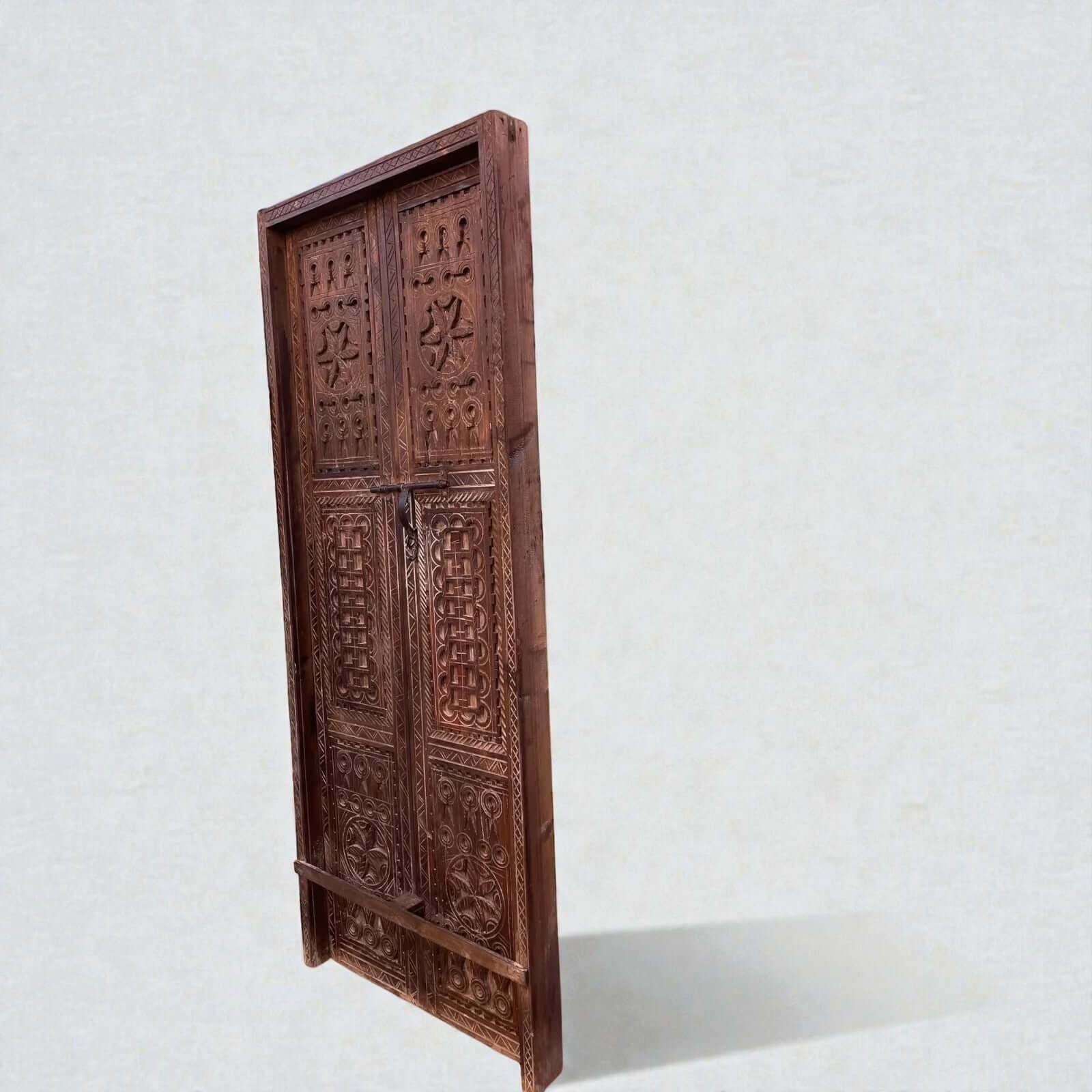 AtlasMuseCrafts natural wood double panel door with intricate hand-carved geometric motifs and a dark wood finish.