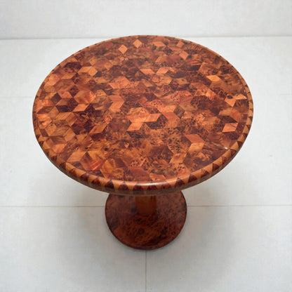 AtlasMuseCrafts handmade round solid wood coffee table with intricate geometric wood inlay pattern and pedestal base.