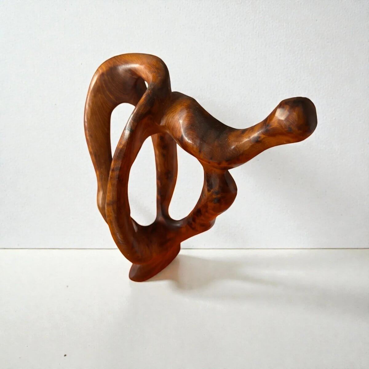 Handmade modern wood sculpture with abstract organic shape