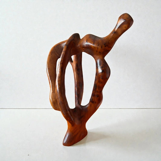 AtlasMuseCrafts handmade abstract wood sculpture with a polished, natural finish. Features organic curves and open spaces, ideal for modern decor.