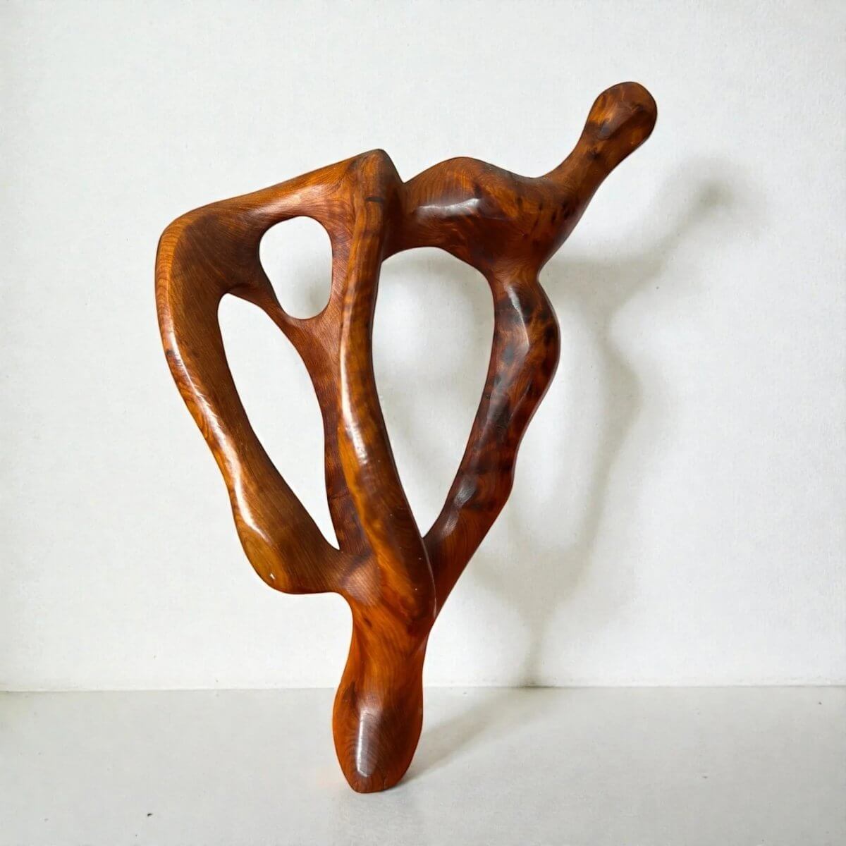 Moroccan contemporary wood sculpture with artisan natural finish