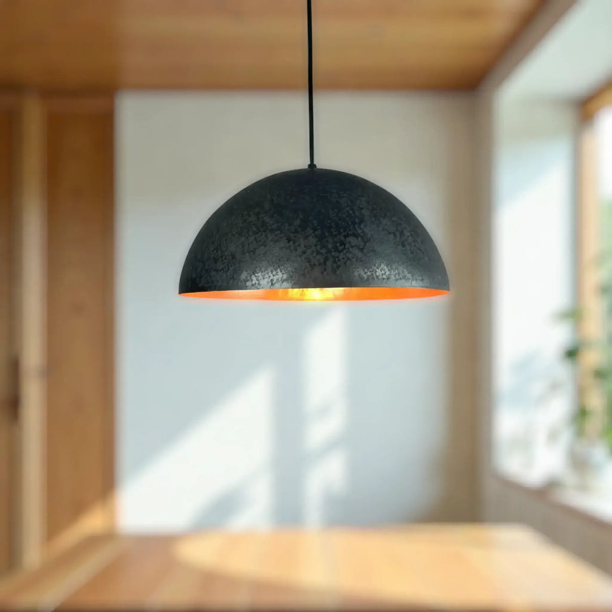 Copper Dome Lamp hanging in a modern interior, featuring a stylish black and orange design.
