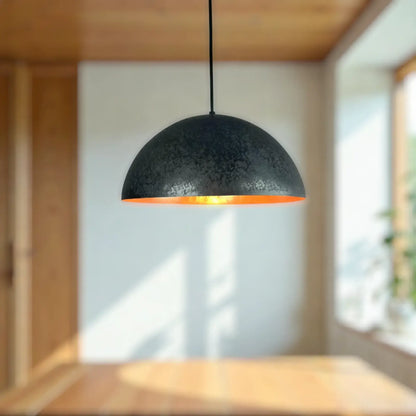 Copper Dome Lamp hanging in a modern interior, featuring a stylish black and orange design.