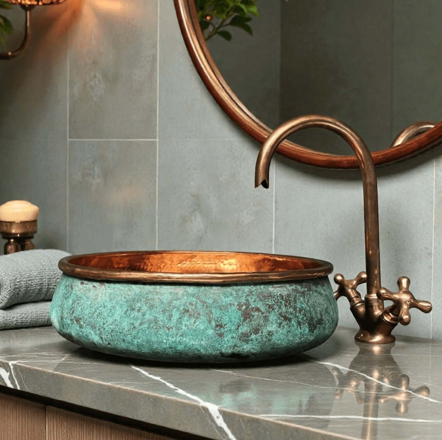 two tone green patina copper vessel sink with hammered design and bronze faucet in modern bathroom setting