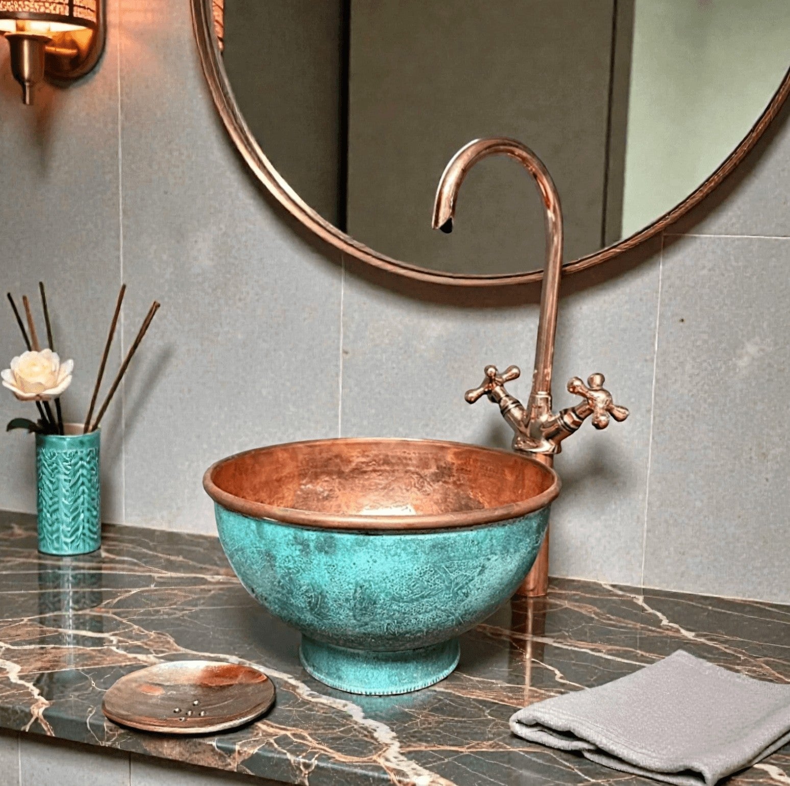 Pedestal green patina copper vessel sink showcased in a stylish bathroom setting with modern fixtures.