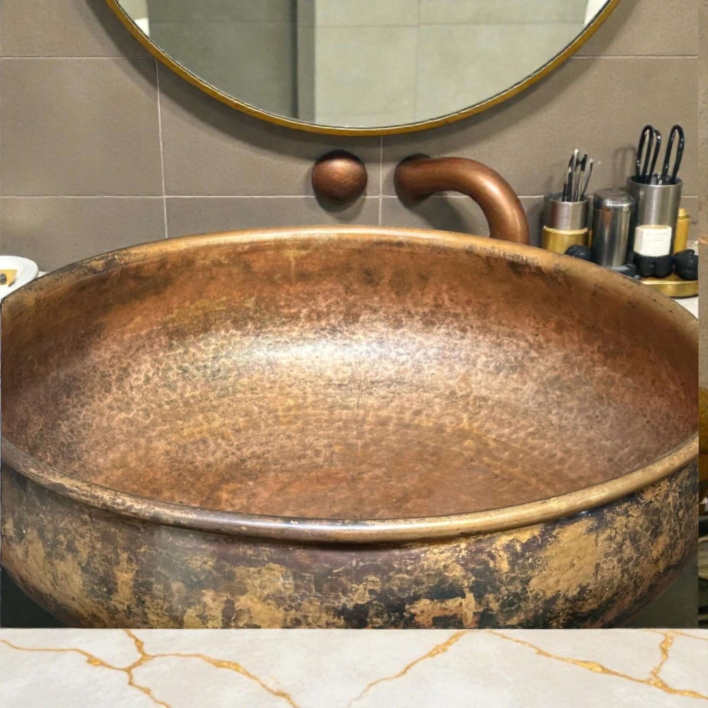 Hammered Copper Bathroom Sink showcased in a stylish bathroom with elegant decor and accessories.