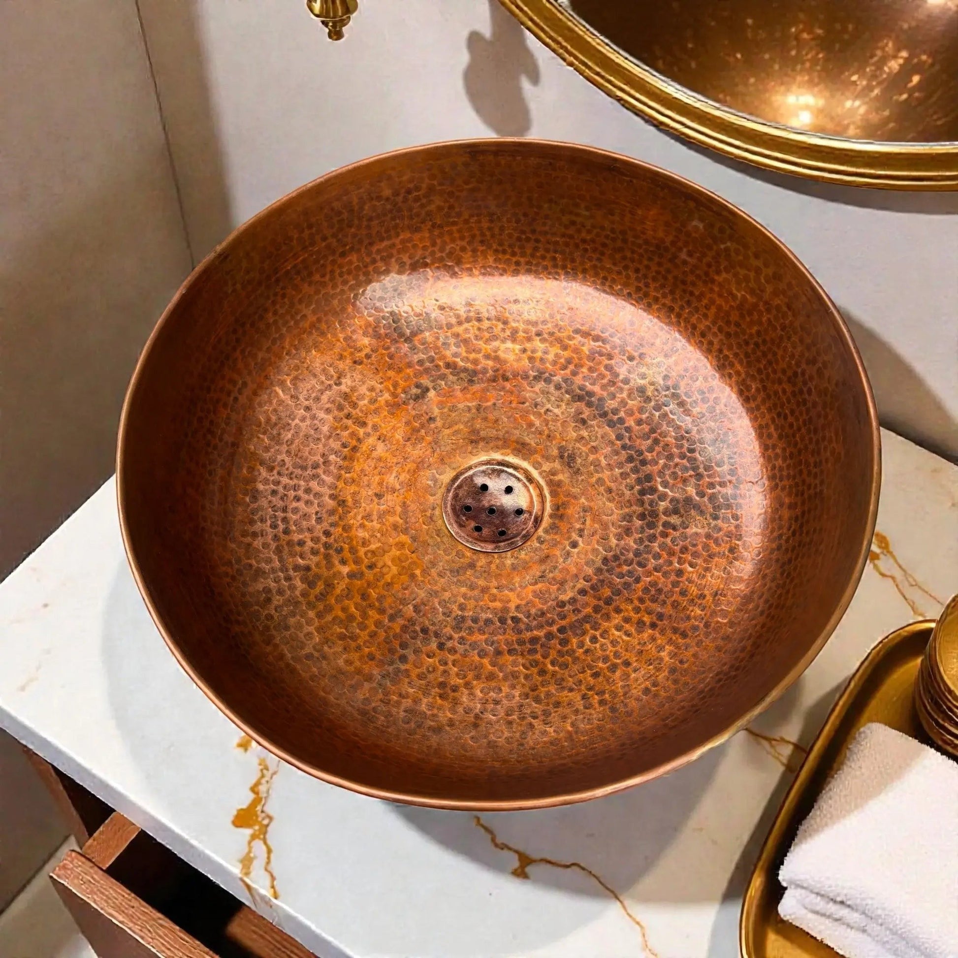sink with a warm antique patina finish