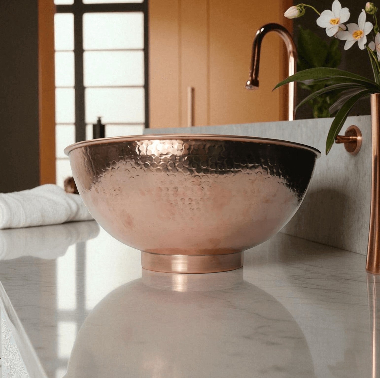 Coppera Studio hammered copper vessel sink with a polished copper base and rim, ideal for bathrooms.
