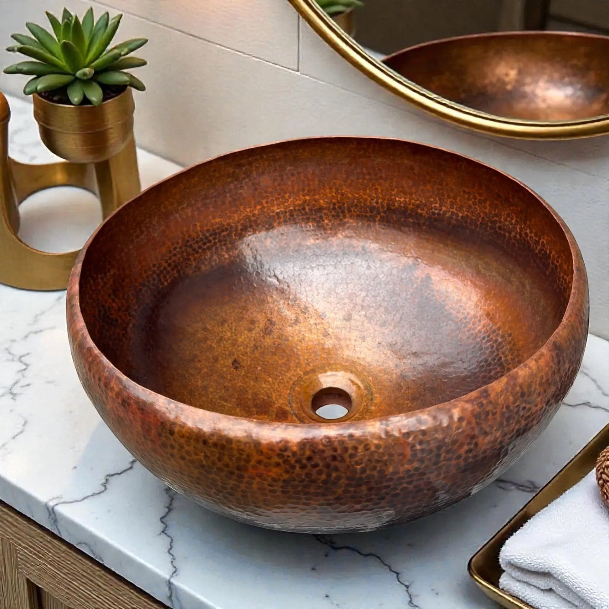 Hammered Brown Copper Vessel Sink featuring a round, rustic design on a marble countertop.
