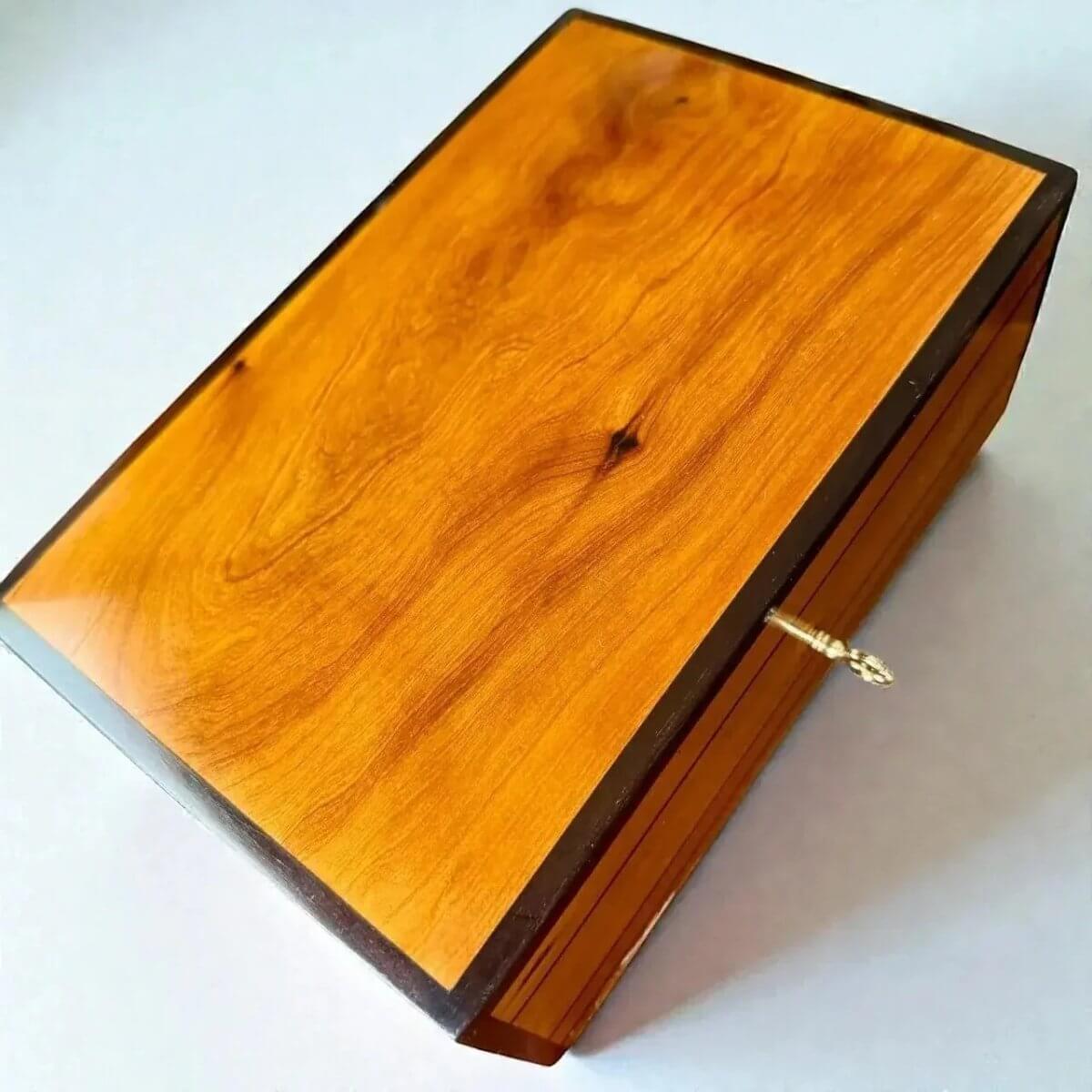 Decorative Wooden Keepsake Box made from Thuya burl wood with a polished finish and brass clasp.