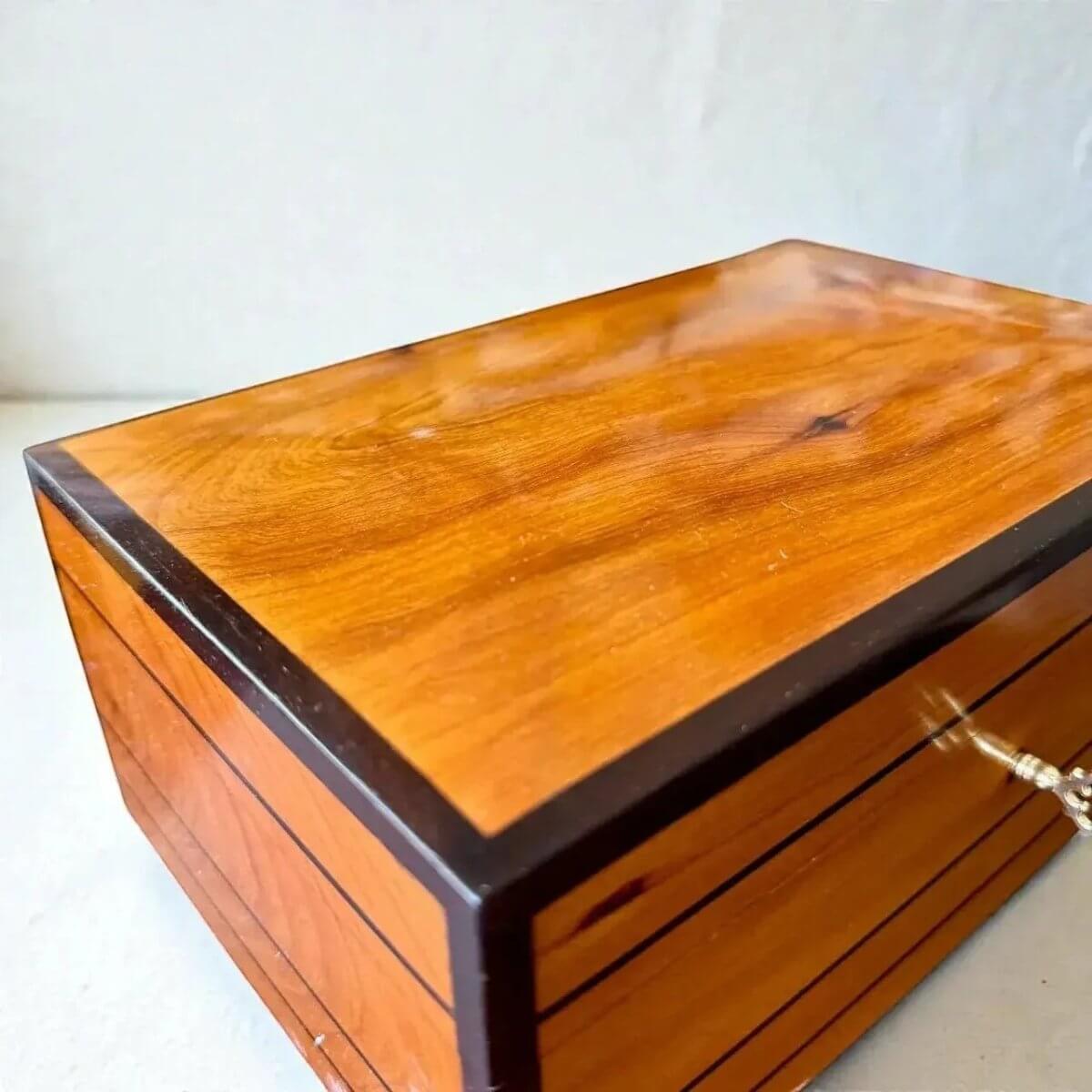 Decorative Wooden Keepsake Box made from Thuya burl wood, showcasing polished finish and elegant brass clasp.