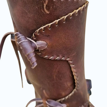 AtlasMuseCrafts handmade brown full-grain leather Viking boots with decorative stitching and leather lacing.